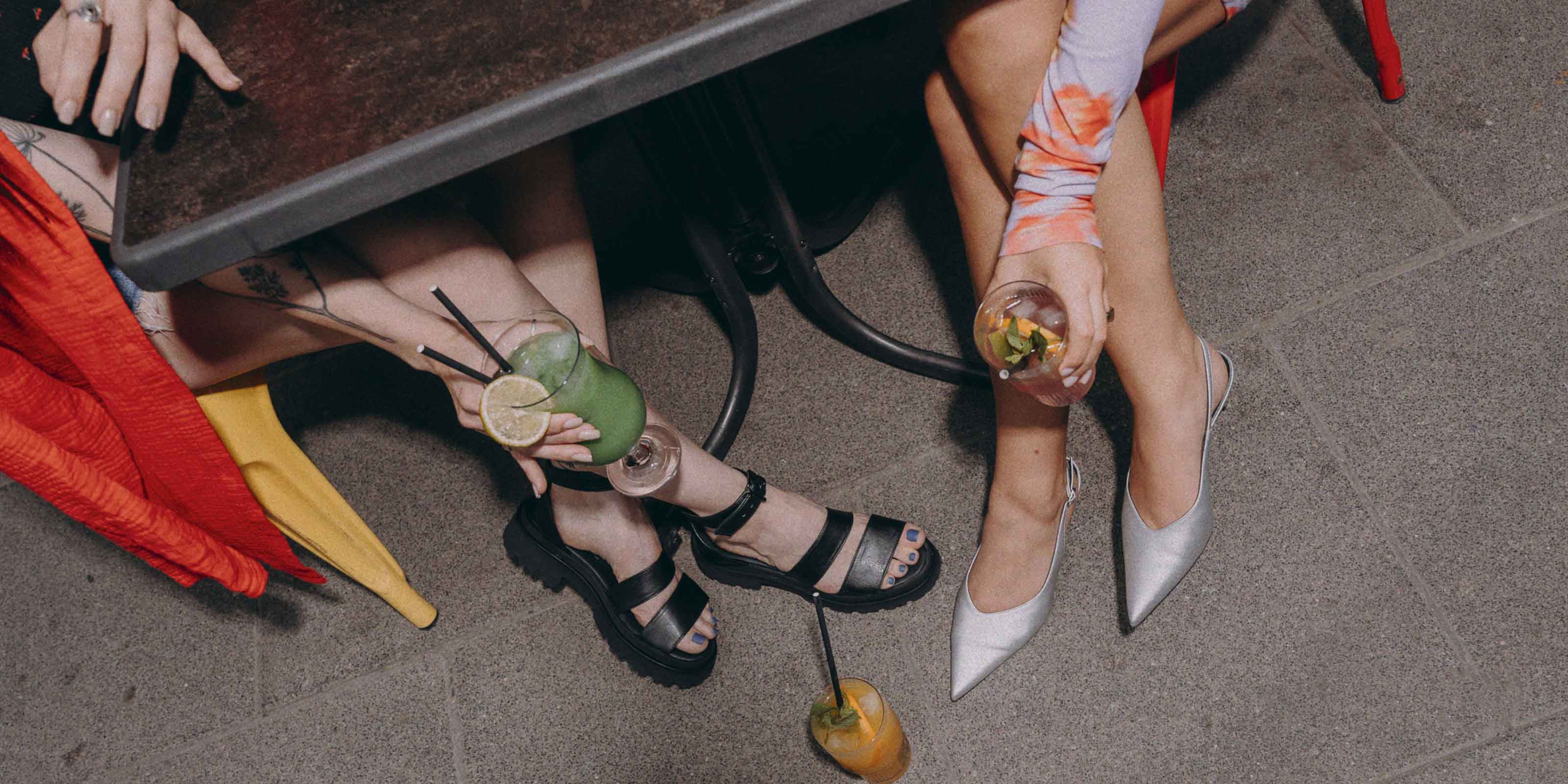two pair of legs and lemonade drinks