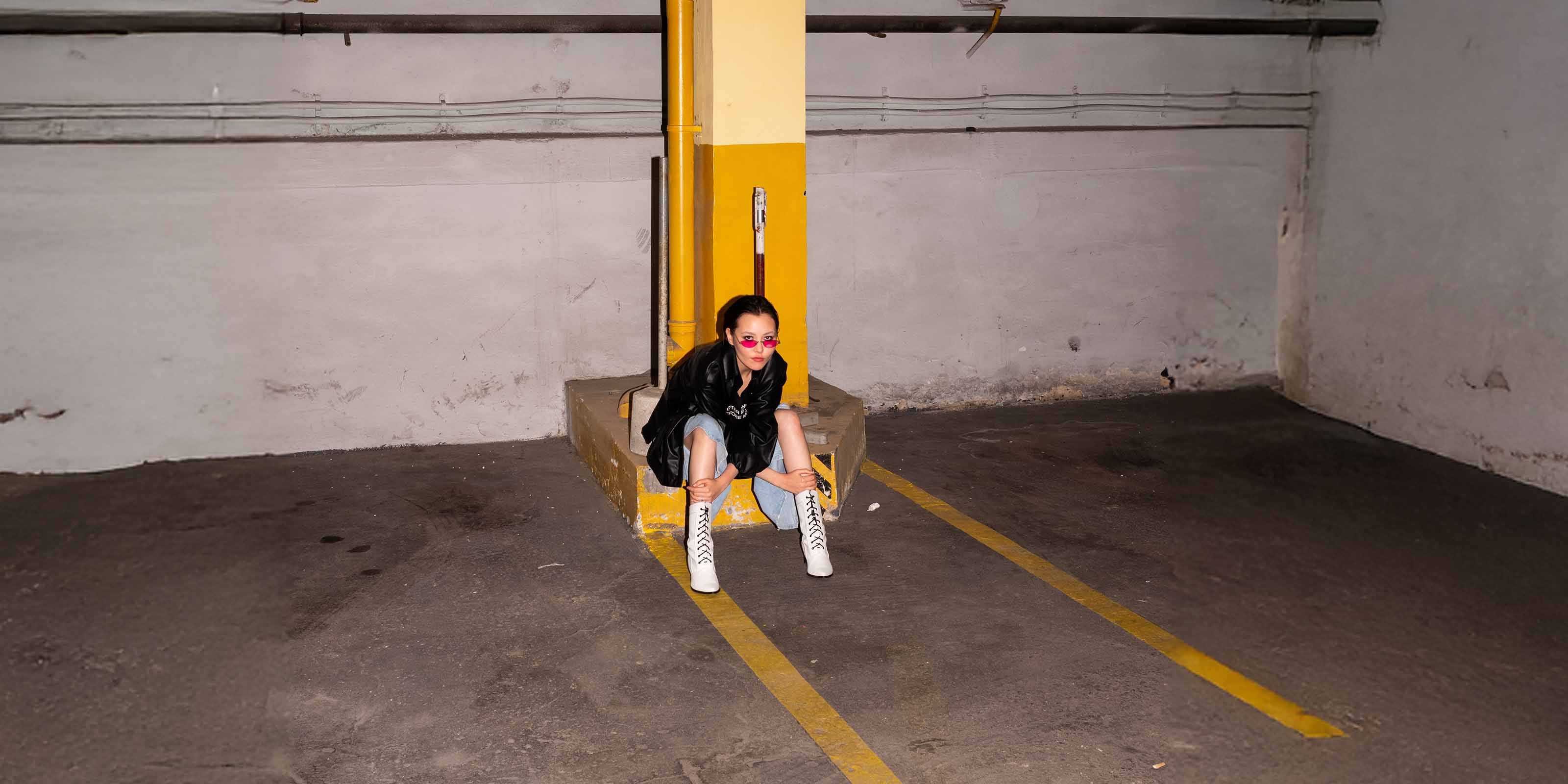 Girl siting on the corner