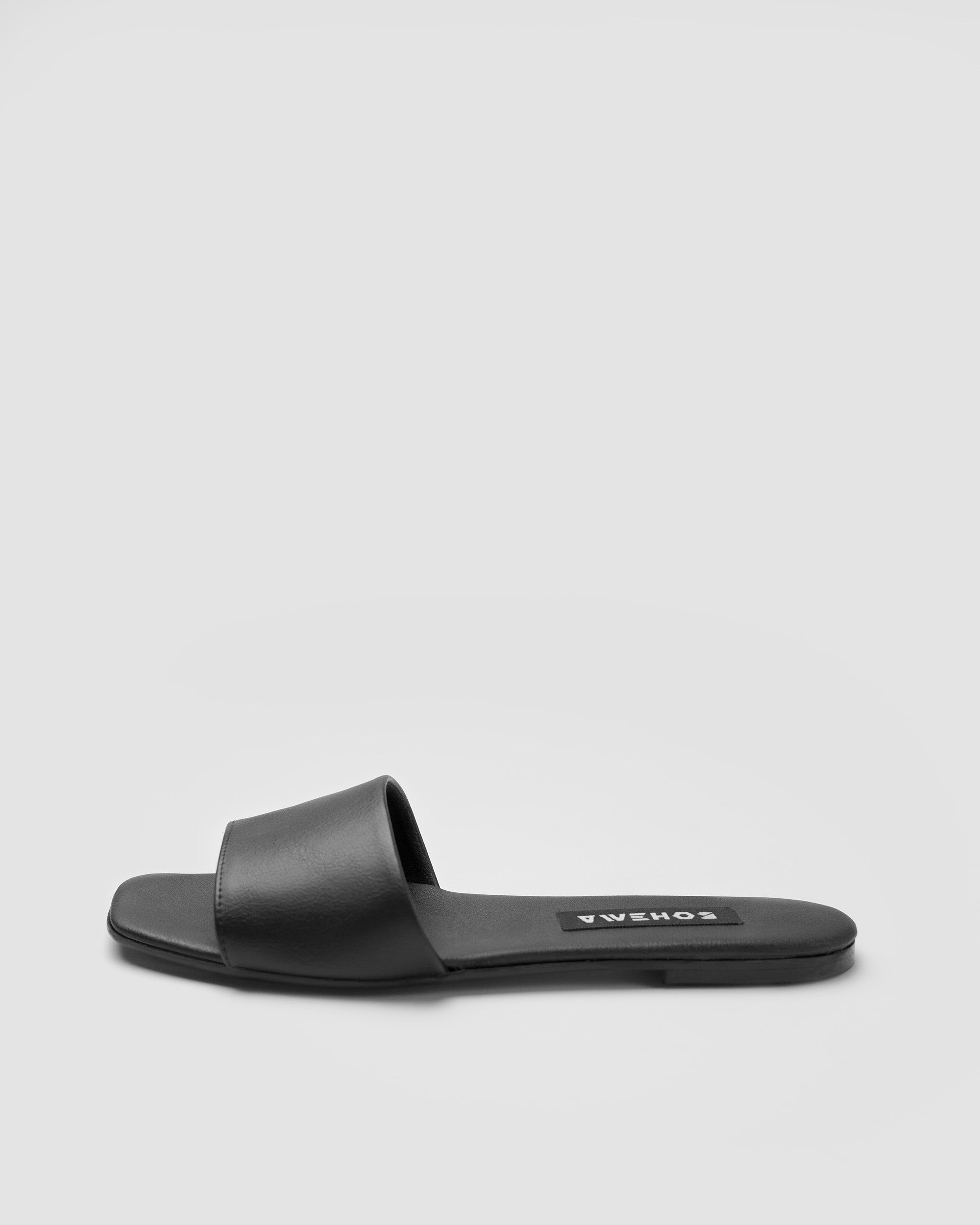 BOHEMA Mellow Slides in black - side view of women's slides