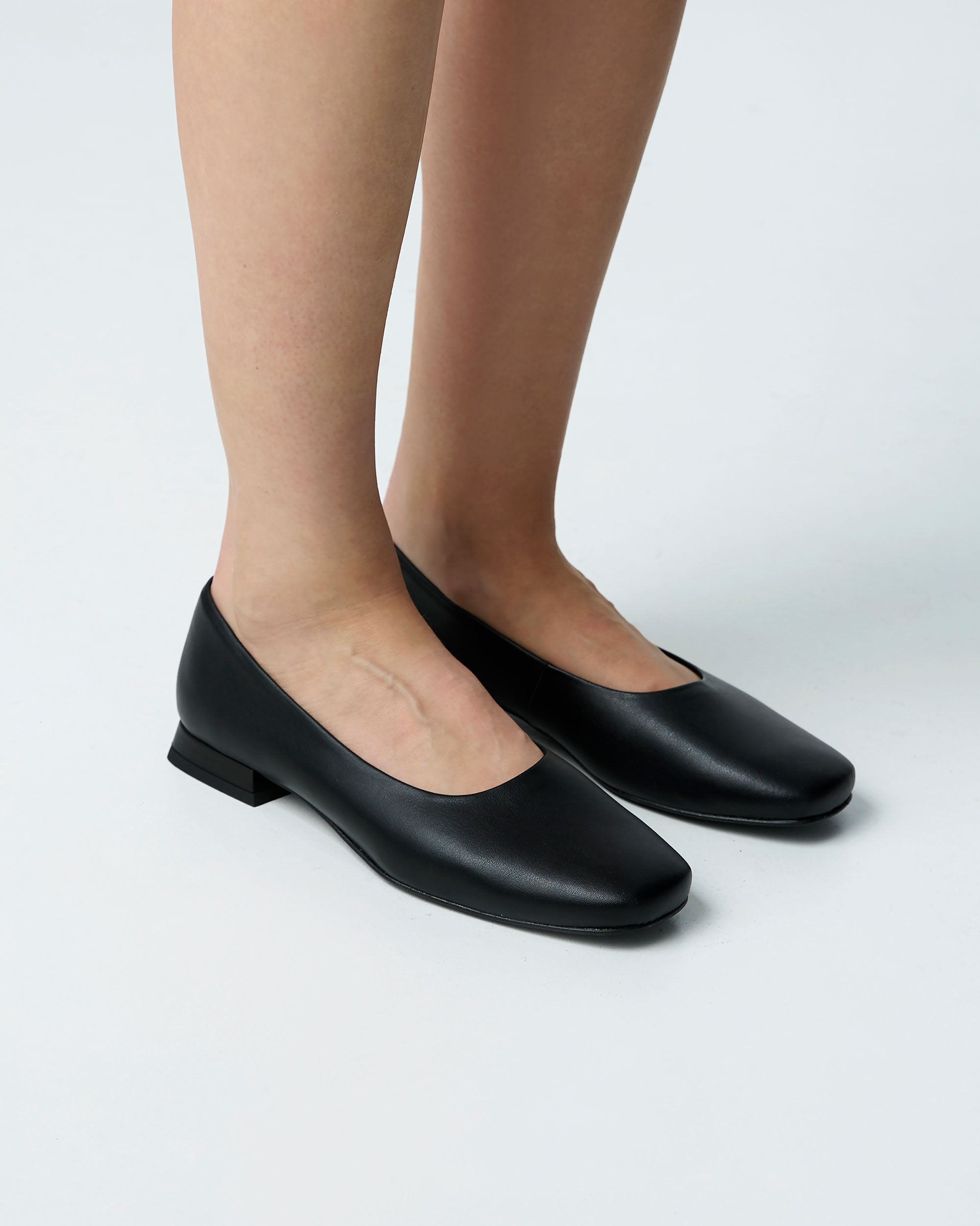 BOHEMA Black Diana Pumps in black - texture close-up of women's square-toe ballet flats