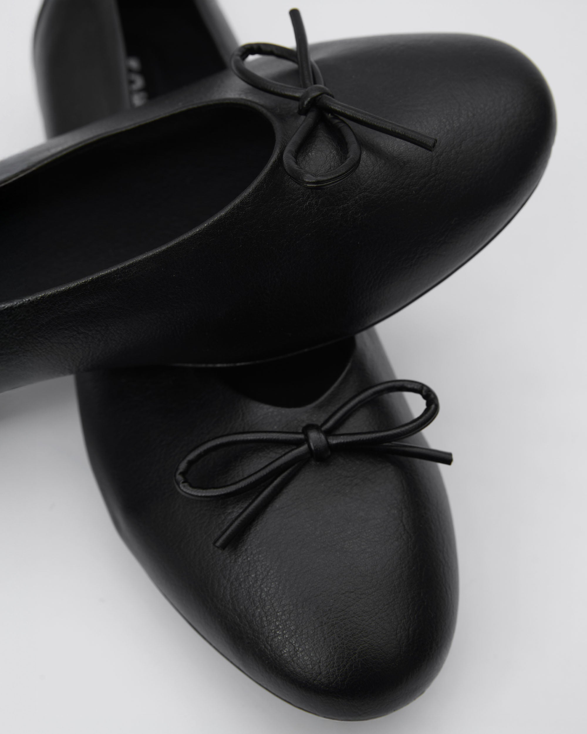 BOHEMA Mossy Pumps in black - worn on foot of women's ballet flats with bow