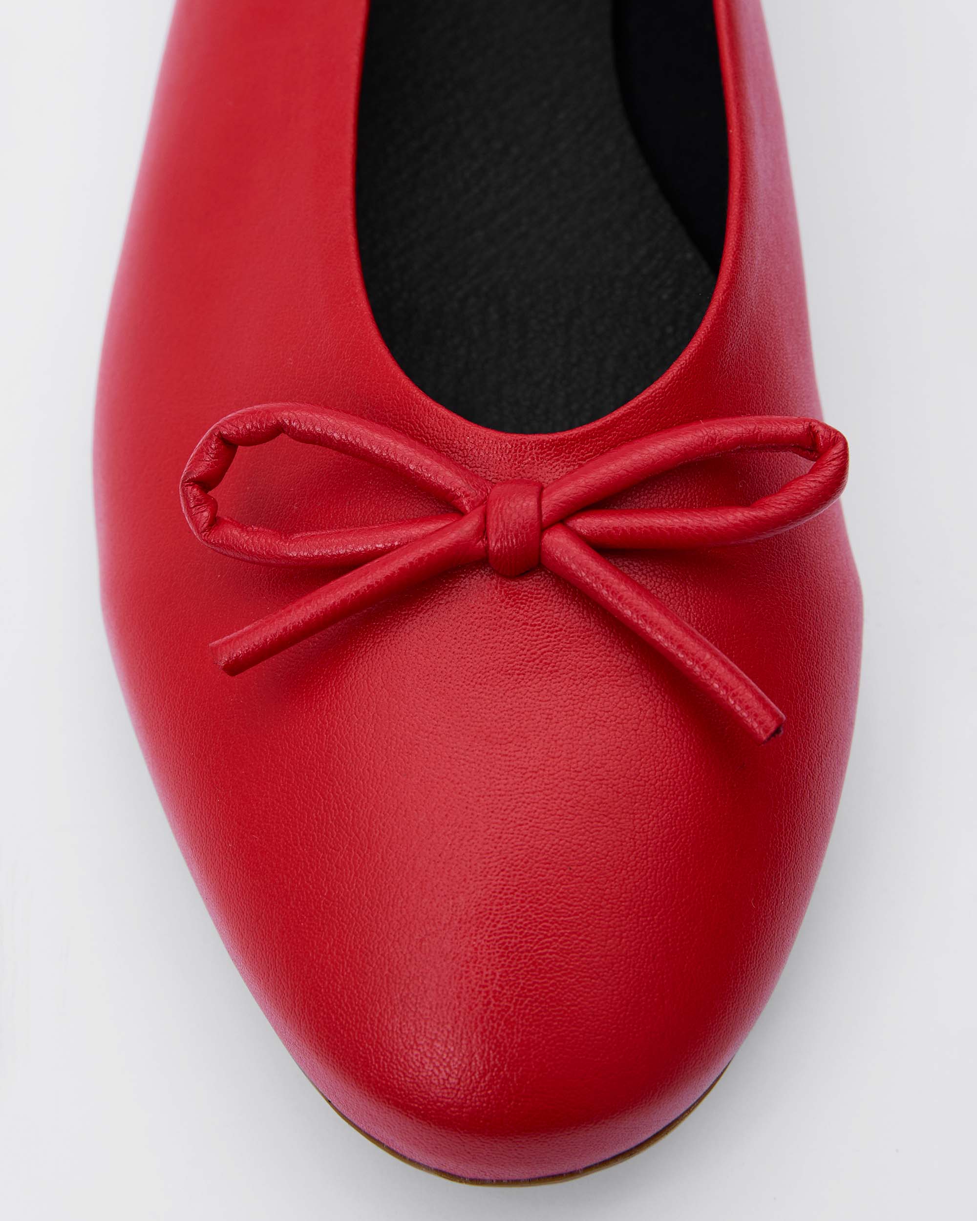 BOHEMA Mossy Pumps in red - worn on foot of women's ballet flats with bow