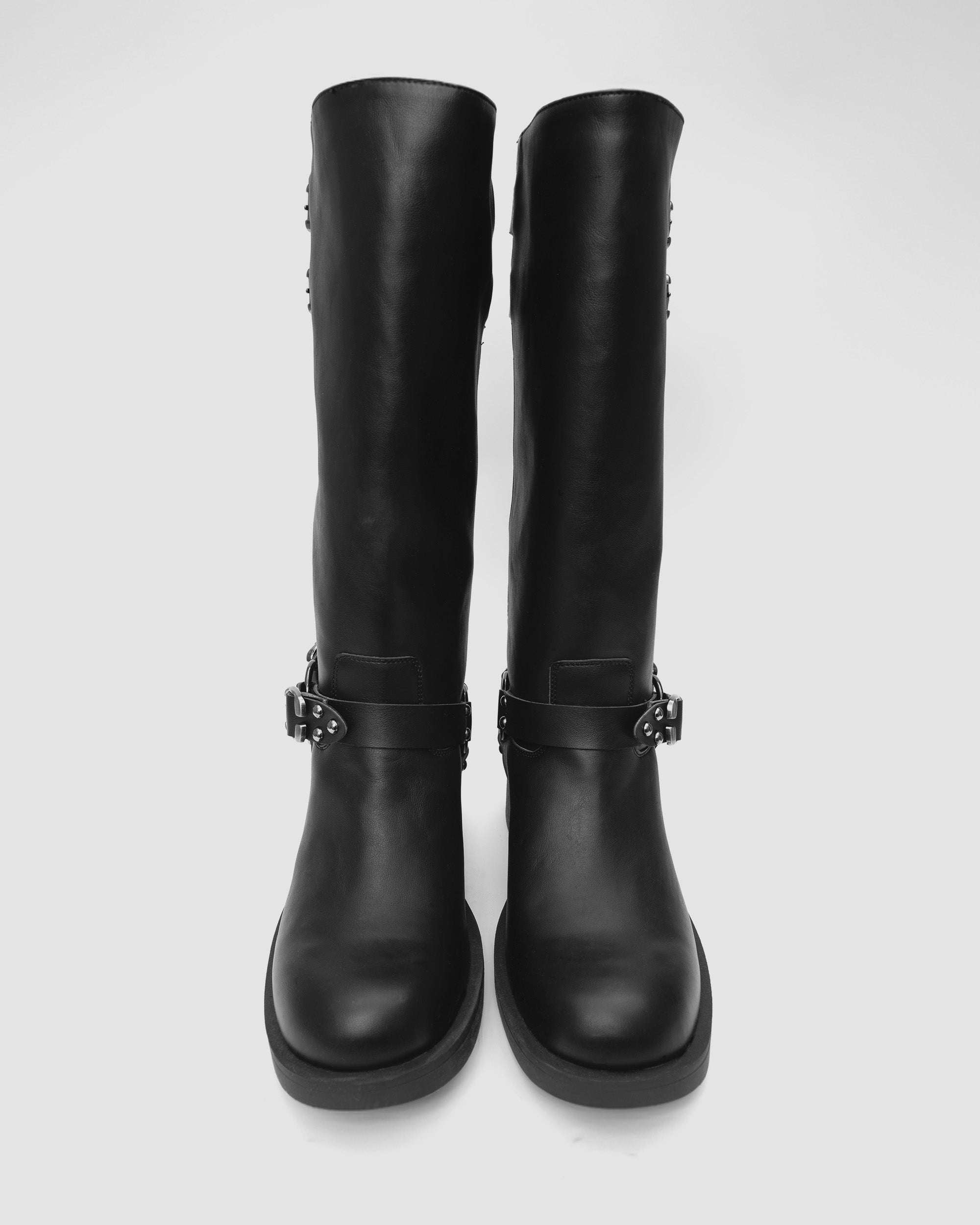 Black vegan biker boots with silver buckle detail, modern design by BOHEMA, on white background